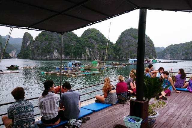 couple in a boat tour in Ha Long Bay in Vietnam