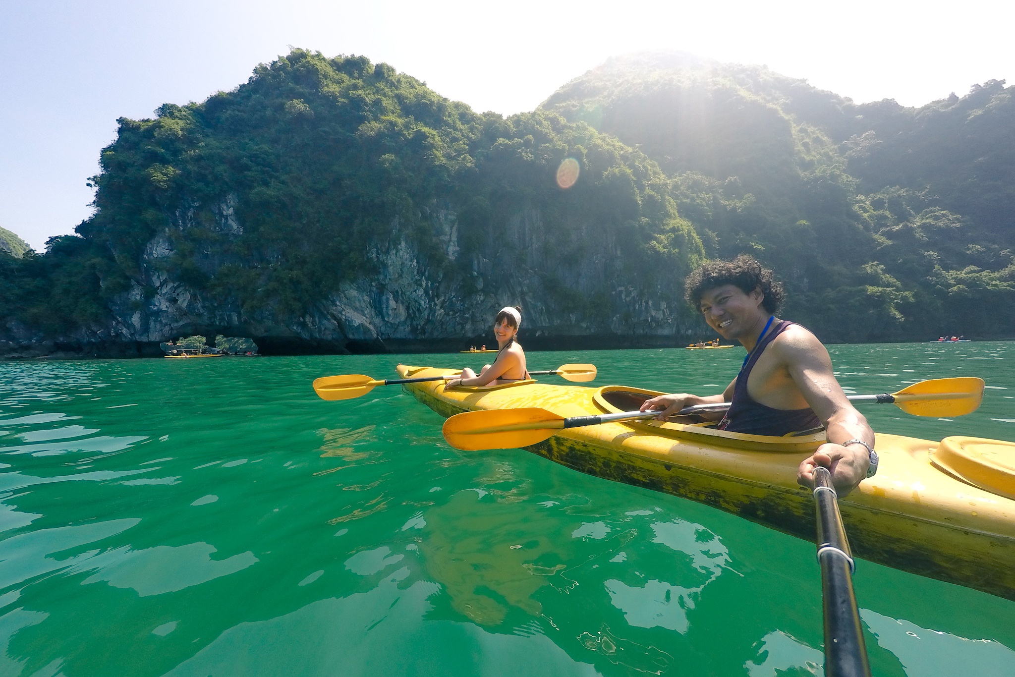 couple doing kayaking in Ha Long Bay in Vietnam