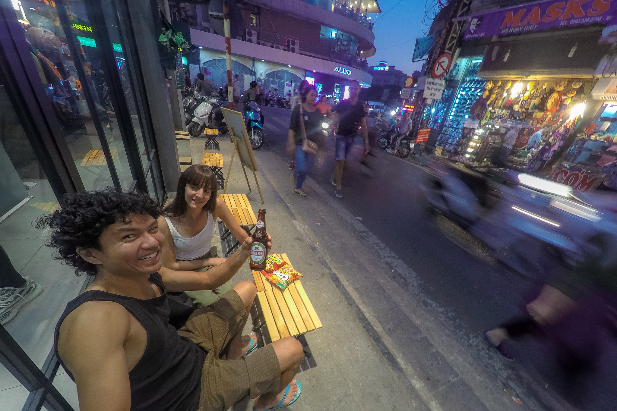 couple drinking a beer in Hanoi city
