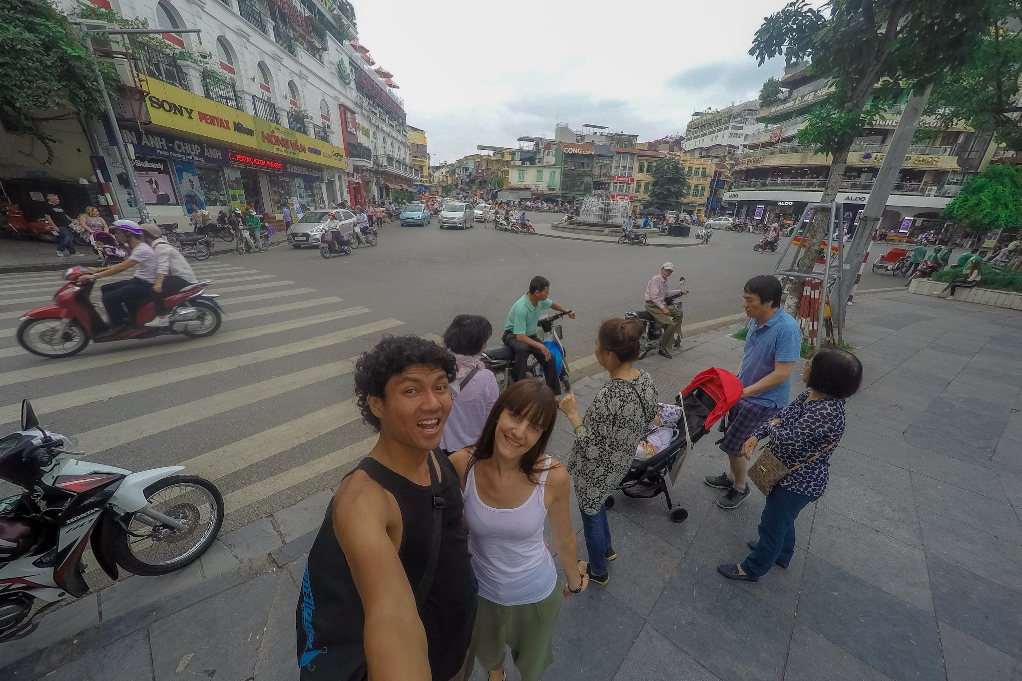 couple in busy street in Hanoi city