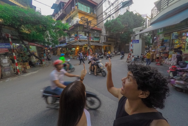 couple in busy street in Hanoi city
