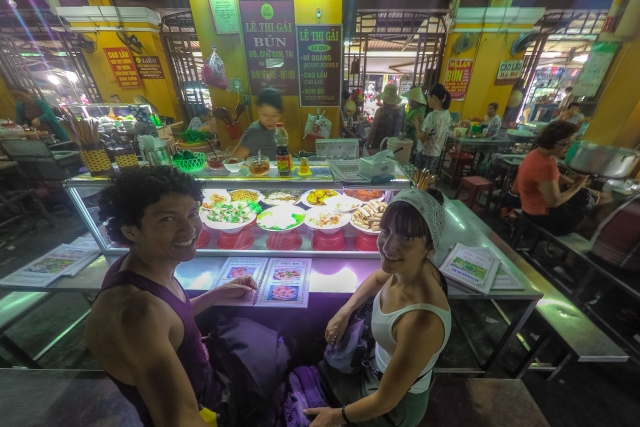 couple eating in a market restaurant in Hoi An Town in Vietnam
