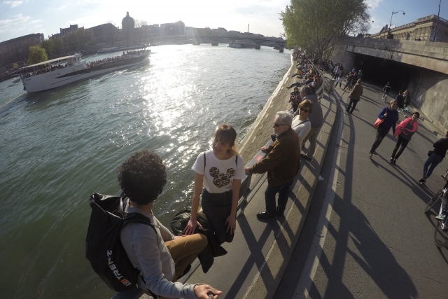 couple walking in Seine River Paris